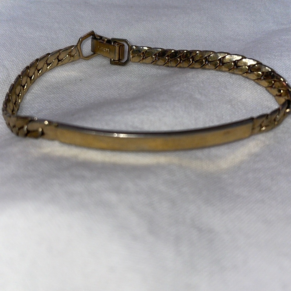 Vintage AVON signed gold tone curved bar bracelet fold over signed clasp